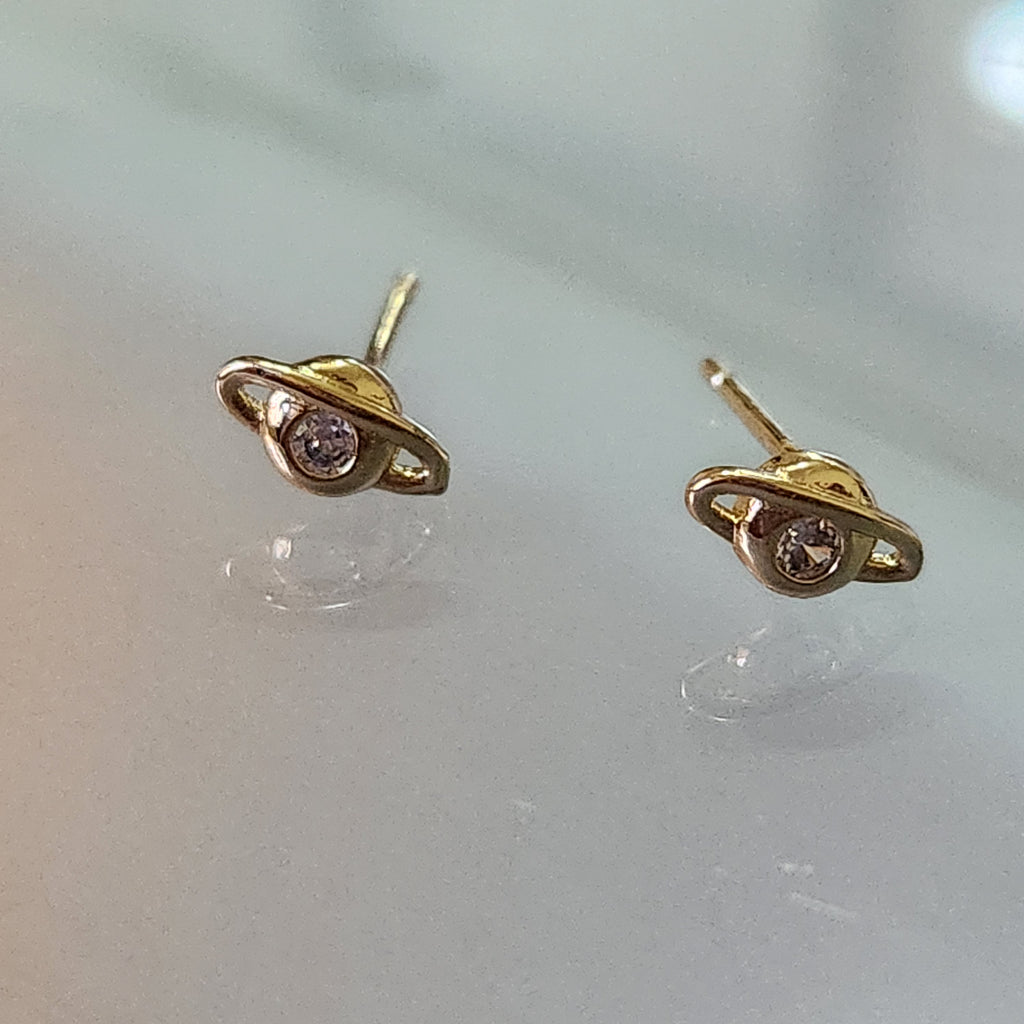 BROQUEL EN ORO LAMINADO MOD SATURNO